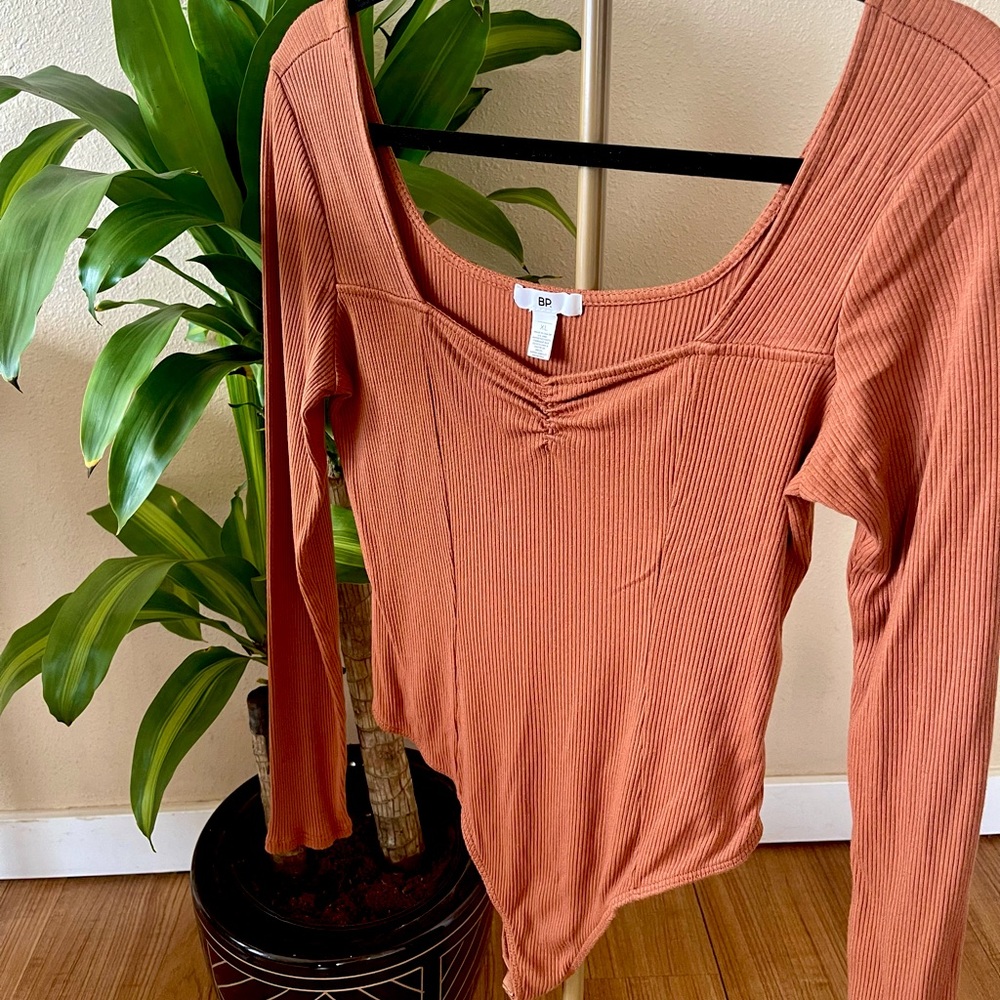 Rusty orange BP bodysuit